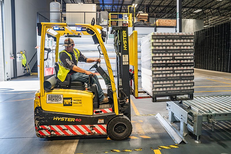 forklift operator in a modern warehouse